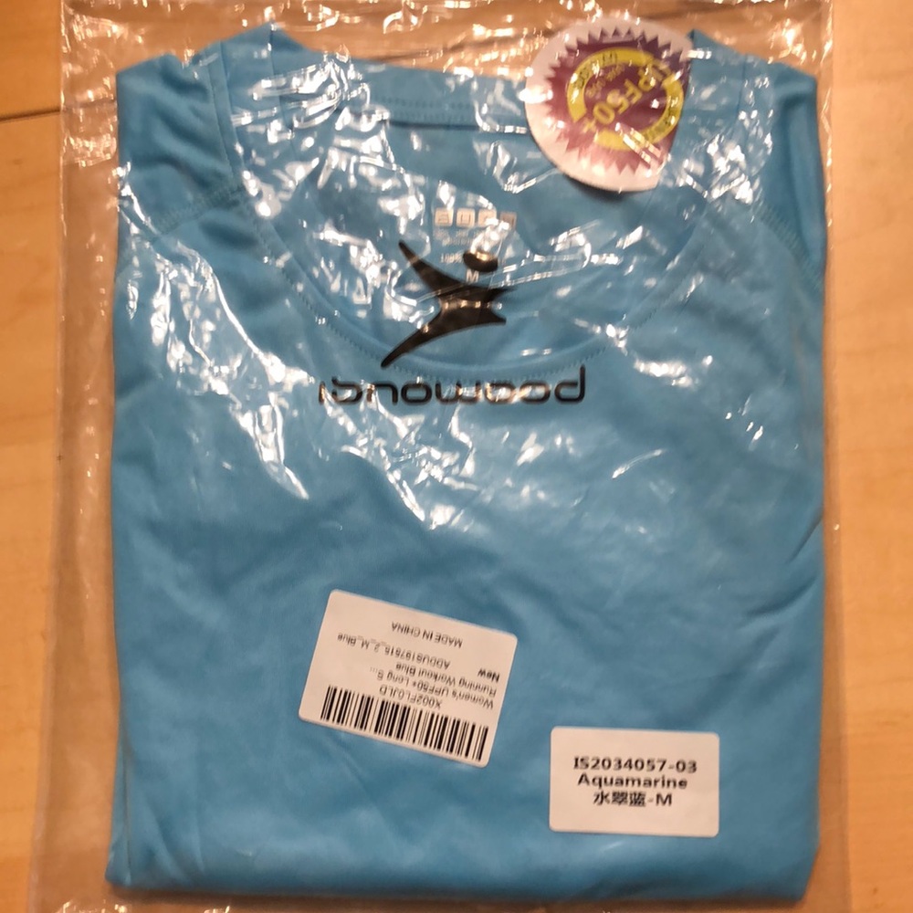 New (still in pkg), long sleeve, running shirt.